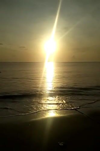 Sunrise captured by witnesses at Calok beach, Indonesia