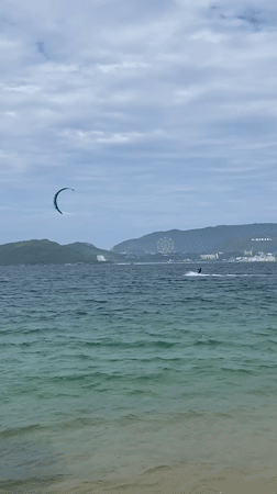 Kitesurfers out on a choppy, cloudy morning in Nha Trang