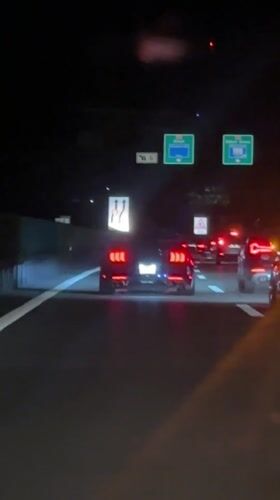 Nighttime highway traffic documented in Glattbrugg, Switzerland