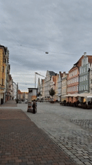 Visitor documents walking tour of historic Landshut Old Town