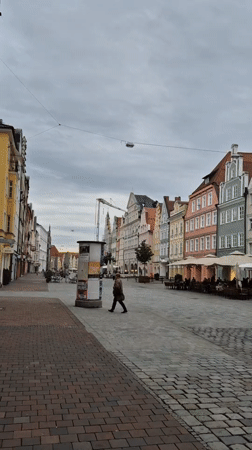 Visitor documents walking tour of historic Landshut Old Town