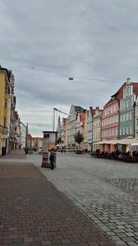Visitor documents walking tour of historic Landshut Old Town