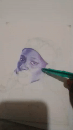 Hand-drawing a shaded face sketch in Takau, Nigeria