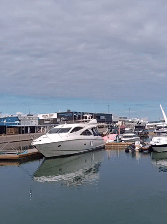 Sunny afternoon at Tallinn's harbor: boats, a classic car, live music
