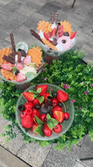 Elaborate desserts displayed on decorated platform in Sochi
