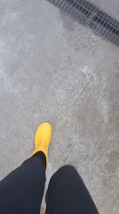 Person documents morning activities with yellow boots and plush toy