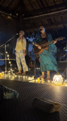Live devotional music night on a candlelit Ko Samui stage