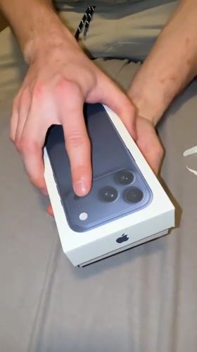 Dark blue iPhone unboxed in Fife, Washington
