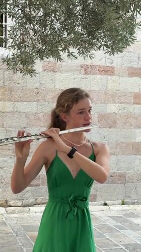 Flute performance in Budva's Old Town cobblestone streets