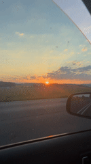 Motorist captures sunset view while driving near Lemgo, Germany