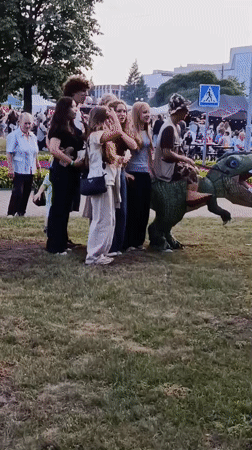 Summer fair in Svietlahorsk with vendors, folk music, and carnival rides
