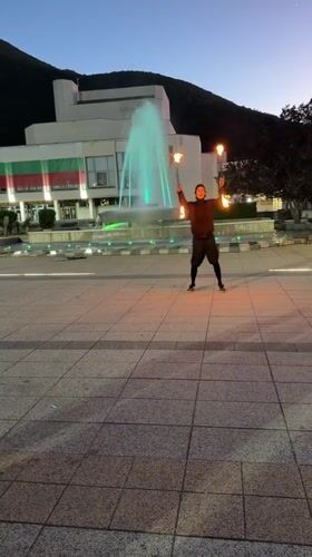 Fire juggler performs at Hristo Botev monument square, Vratsa