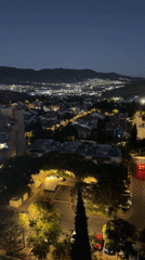 Karmiel neighborhood glows at the foot of the mountains at night