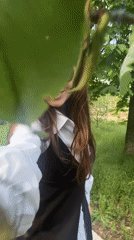 Woman records herself with dandelions in Kryvyi Rih park
