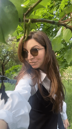 Woman records herself with dandelions in Kryvyi Rih park