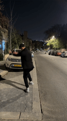 Men dance, take selfies on Jerusalem street at night