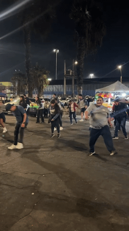 Traditional dance group performs nighttime street choreography in Arica