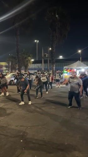 Traditional dance group performs nighttime street choreography in Arica