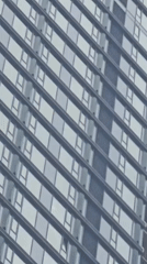 Worker performs high-rise maintenance on Moscow skyscraper