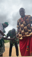 Men don traditional Nigerian dress in Aba morning gathering