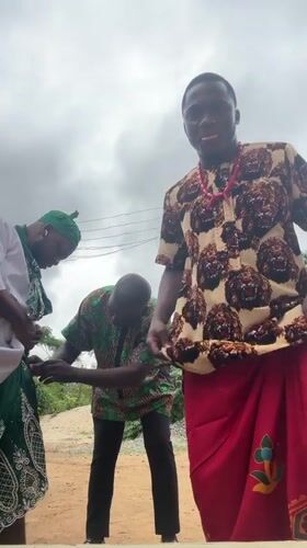 Men don traditional Nigerian dress in Aba morning gathering