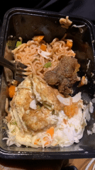 Person holds prepared noodle meal in Gura Top, Nigeria