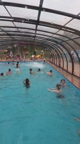 Children swim at covered pool facility in Birobidzhan, Russia