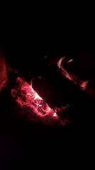 Fireplace burns with logs and embers in Elena, Bulgaria