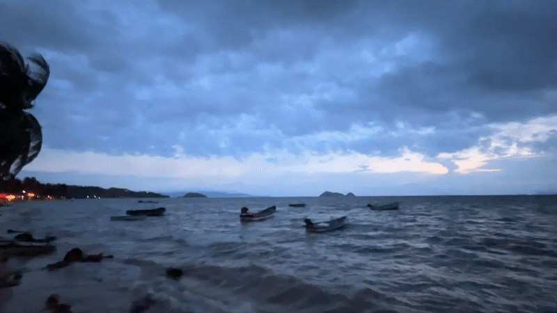 Stormy twilight over Ko Pha-ngan's coast, moon through heavy clouds