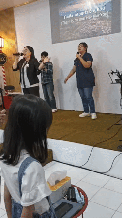 Live music performance at a community hall in Magelang