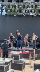 Male singer performs with dancers at outdoor Kemer venue