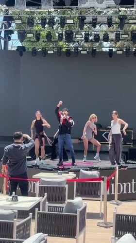 Male singer performs with dancers at outdoor Kemer venue