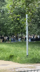 Young adults gather for social activities in Milan park