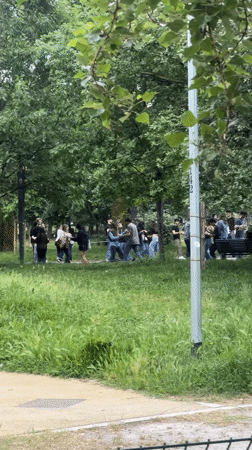 Young adults gather for social activities in Milan park