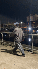 Night visitors interact with public sculptures in Buenos Aires