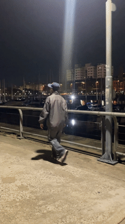 Night visitors interact with public sculptures in Buenos Aires