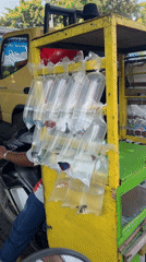 Mobile betta fish vendor operates from motorcycle cart in Denpasar