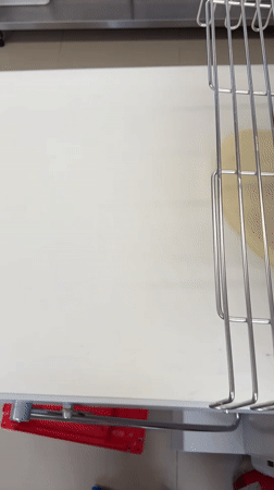 Baker prepares chocolate pastries in Belgrade commercial kitchen