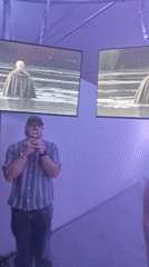 Samara residents view video installation in illuminated exhibition space