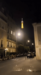 Nighttime video captures illuminated Eiffel Tower in Paris