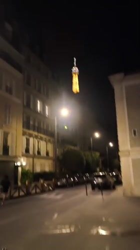 Nighttime video captures illuminated Eiffel Tower in Paris