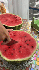 Watermelon prep session on mosaic table in Krasnoyarsk