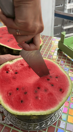 Watermelon prep session on mosaic table in Krasnoyarsk