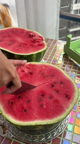 Watermelon prep session on mosaic table in Krasnoyarsk
