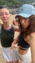 Two women take beach selfies in Đà Nẵng