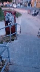 Metal sign with man and woman spotted on Barcelona stairs
