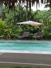 Morning rain and yoga captured at tropical retreat