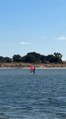 Wing foiling on San Diego water on a sunny afternoon