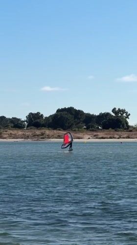 Wing foiling on San Diego water on a sunny afternoon