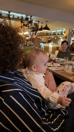 Baby and caregiver share moment at Khimki restaurant